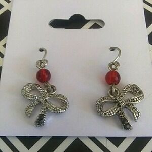 Silver dangle bow‎ earrings with red accent bead